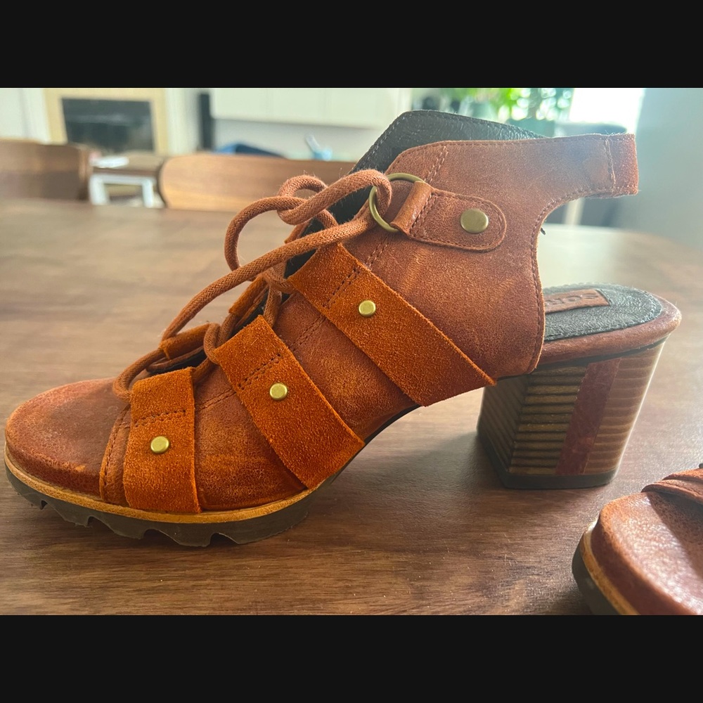 Sorel brown leather lace up peep toe heel.